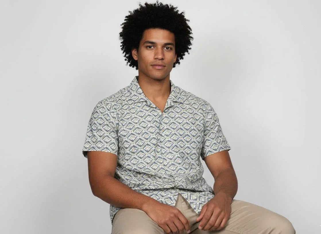 Man wearing a patterned short-sleeve shirt and beige pants, ArokaLife modern fashion style