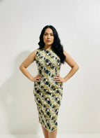 Woman modeling a fitted sleeveless printed dress from ArokaLife against a plain white background.