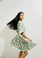 Woman modeling modern printed dress with flowing hair, ArokaLife New Zealand fashion