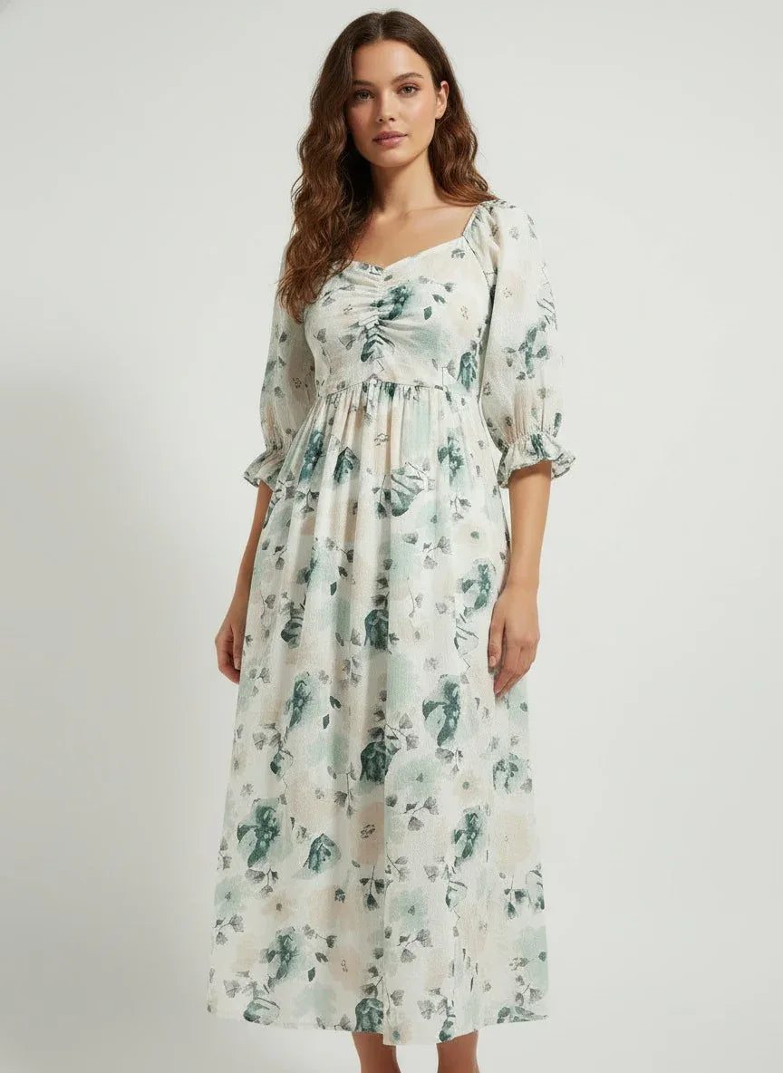 Woman in ArokaLife floral midi dress with puff sleeves, showcasing modern New Zealand fashion.